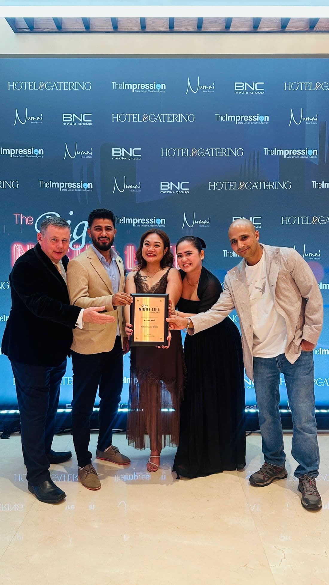 Reform Social & Grill team collecting an award
